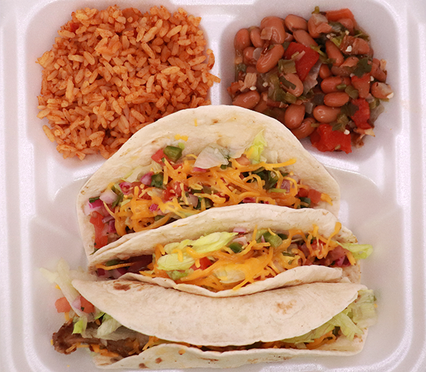 Three taco plate with rice and beans